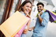 © NDABCREATIVITY - Happy attractive loving couple enjoy shopping together