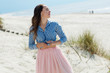 © Ulia Koltyrina - Beautiful and stylish brunette walking on the beach. Portrait in profile