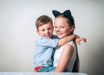 Happy boy with sister having fun