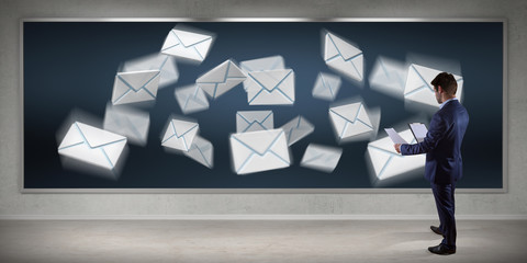Wall Mural - Businessman using email interface on a board 3D rendering