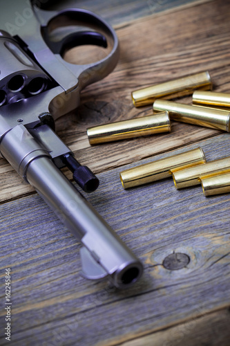 Fotografie, Obraz part of an vintage nagant revolver with cartridges