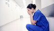 © Syda Productions - sad or crying female nurse at hospital corridor
