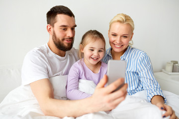 Sticker - happy family taking selfie by smartphone at home