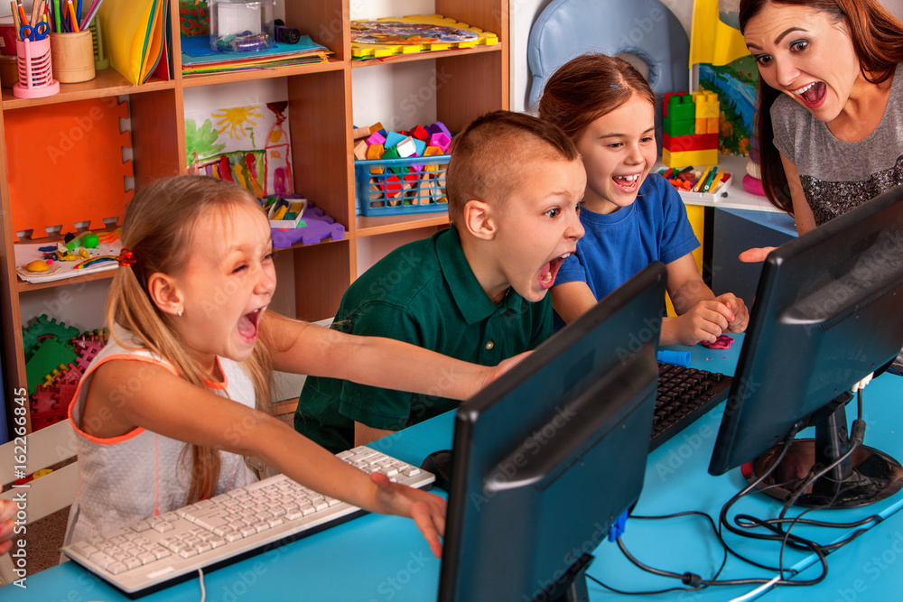 Children computer class us for education and video game. Boys and girls ...
