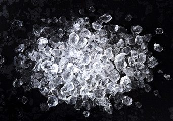 Wall Mural - crushed ice on black background. top view with copy space
