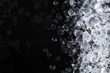 Crushed Ice Background. Pieces Of Crushed Ice Cubes On Black Background. Copy Space, Top View