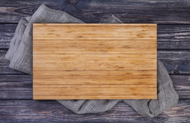 serving tray over old wooden table, cutting board on dark wood background, top view