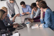 © .shock - Group of young people meeting in startup office