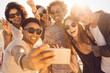 © Drobot Dean - Group of multiracial happy friends taking selfie and having fun