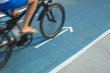 © lobro - Person riding a bike on bicycle lane or cycle path outdoors