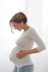 Pregnant woman touching belly