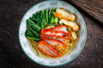 Wall Mural - Chinese food : noodle dumpling with parsley and roasted red pork