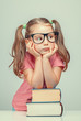 © Myst - beautiful cute little girl leaning on thick books