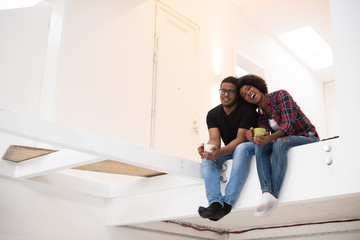 Wall Mural - couple having break during moving to new house