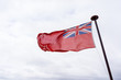 uk red ensign the british maritime flag flown in white sky