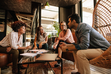 Wall Mural - Creative people having a meeting in modern office