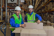 © a_medvedkov - Male workers lookong inside boxes in warehouse