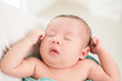 © Atstock Productions - Cute little newborn baby sleeping in the arms of mother