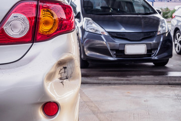 car has dented rear bumper damaged after accident