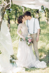 Wall Mural - wedding couple on  nature.  bride and groom hugging at  wedding. 