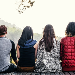 Wall Mural - Friends Sitting in a Row Outdoors Concept