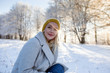 © Myvisuals - Beautiful blonde woman with yellow beanie enjoying the winter sun.