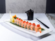 Plate of Tiger roll sushi style with soy sauce
