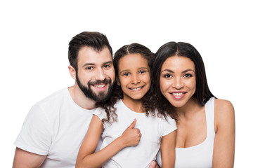 Wall Mural - Happy multiethnic family showing thumb up and smiling at camera