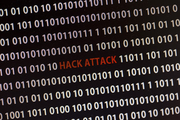 Wall Mural - hack attack text on the computer screen surrounded by numbers one and zero.