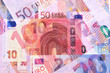 © helen_g - Euro Money Banknotes of Different denominations abstract background.