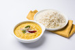 Indian popular food Dal fry or traditional Dal Tadka Curry served with jeera rice, isolated over white background, selective focus
