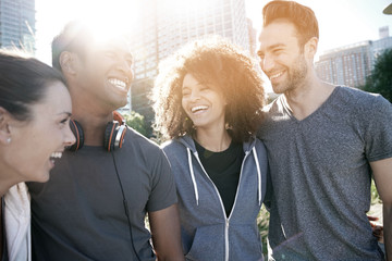 Wall Mural - Group of friends having fun at the park ready to jog