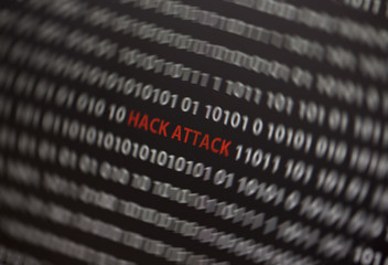 Wall Mural - hack attack words in red in the middle of the computer screen. surrounded by 0 and 1 numbers. image 