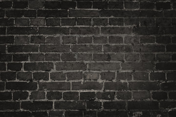 Wall Mural - Old black brick wall background.