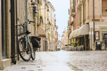 Poster - bicycle stands near the house in Adria, Italy