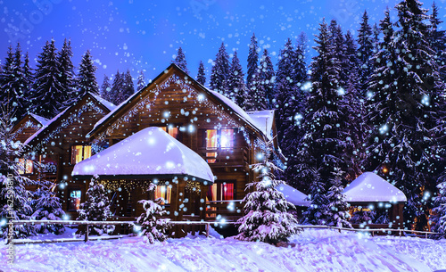 Fotografía A fairy-tale house in the woods amid the snow-covered fir trees, Christmas landscape