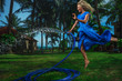 Woman watering with garden hose