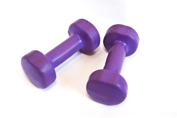 Purple dumbbells on a white background