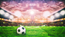 Soccer Ball On Green Field Of Football Stadium For Background
