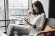 © LUMINA IMAGES - Business woman using tablet