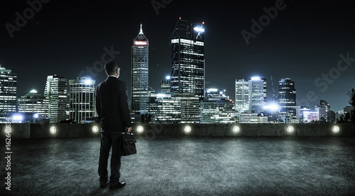Businessman Looking And Thinking At Roof Top With Modern City Skyline Background Night Scene Stock Foto Adobe Stock