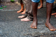 african immigrants bare feet at march asking for hospitality for refugees in Rome