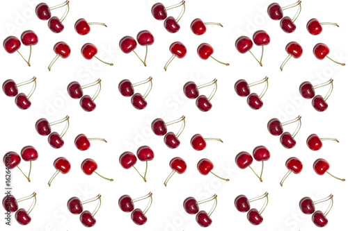 pattern of red shiny sweet cherry berries