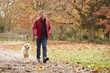 © Monkey Business - Mature Man On Autumn Walk With Labrador