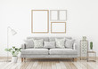 Interior poster mock up with four frames composition on the wall in scandinavian style livingroom. 3d rendering.
