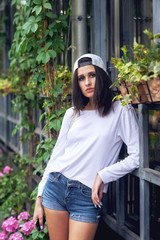 Wall Mural - Fashion model on the street. Beautiful young woman in stylish summer clothes