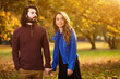 © astrosystem - Cute couple hanging out in the park.