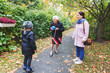 © Maskot - Senior woman and great grandson playing with ball while woman standing in park