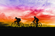 Silhouette of sportsmen riding a bicycle