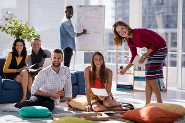 Wall Mural - Portrait of happy executives working together